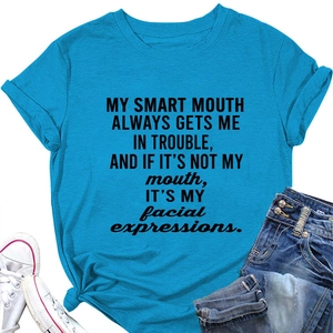 Close-up of blue cotton T-shirt featuring black slogan print and cuffed short sleeves