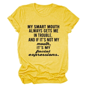 Detail of soft yellow cotton fabric texture and black letter printing on the casual T-shirt