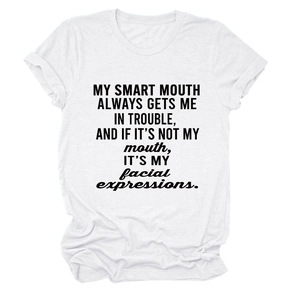 Detail of white cotton crewneck t-shirt with black slogan print and rolled sleeve cuffs