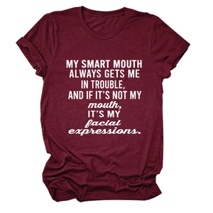 Detail of burgundy cotton crewneck T-shirt with white smart mouth graphic print