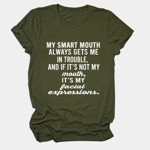 Detail of soft olive green cotton T-shirt showing round neckline and white printed text