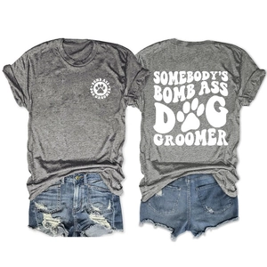 Detail view of heather grey T-shirt with double-sided dog groomer print and denim shorts
