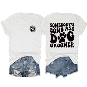 Detail view of double-sided dog groomer print on white cotton crewneck t-shirt
