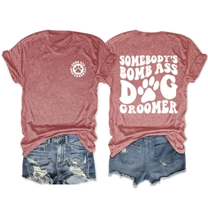 Detailed front and back view of red-brown dog groomer t-shirt with white printed lettering