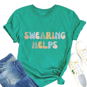 Flat lay of a teal cotton t-shirt with swearing helps graphic text and blue ripped jeans