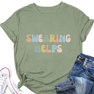 Detail view of the green 'SWEARING HELPS' slogan t-shirt with rolled sleeves and knotted hem