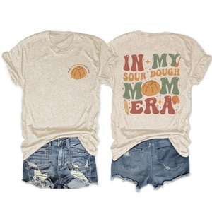 Flat lay of sourdough mom era t-shirt front and back with denim shorts detail
