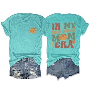 Front and back view of teal sourdough mom era t-shirt with ripped denim shorts