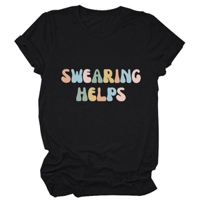 Detail of the colorful gradient 'SWEARING HELPS' typography on a black cotton t-shirt