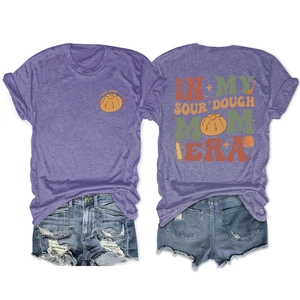 Detail of purple sourdough mom era t-shirt and frayed denim shorts set on white background
