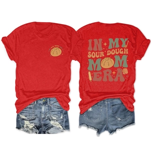 Close-up of vintage baking graphics on a red t-shirt showing both front and back views