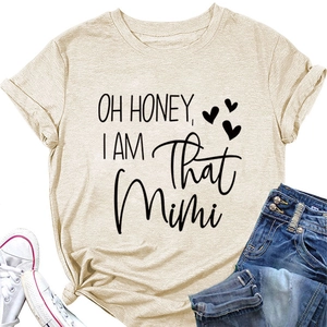 Flat lay of beige Oh Honey I Am That Mimi t-shirt with jeans and white sneakers