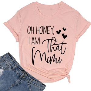 Detail of pink Oh Honey I Am That Mimi t-shirt with knotted hem and denim shorts