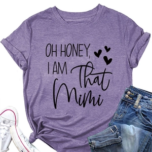 Close-up of Oh Honey I Am That Mimi slogan print on purple cotton t-shirt fabric