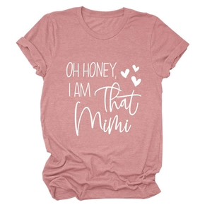 Detailed close-up of pink casual t-shirt with OH HONEY I AM THAT MIMI white text print