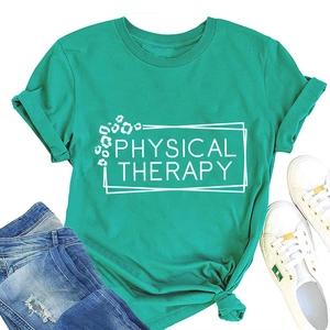 Flat lay of emerald green Physical Therapy t-shirt with leopard print text and white sneakers