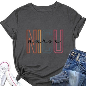 Flat lay of dark gray NICU Nurse t-shirt paired with denim shorts and sneakers