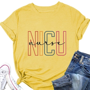 Flat lay of bright yellow NICU nurse T-shirt with a stylish knotted hem and accessories