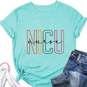Flat lay of a mint green NICU nurse t-shirt with artistic lettering and casual accessories