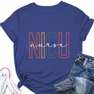 Flat lay of a blue NICU nurse T-shirt paired with denim shorts and white sneakers