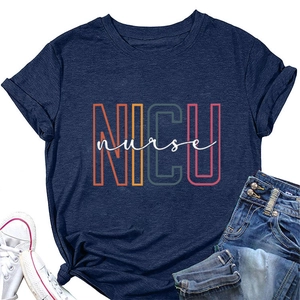 Detail of navy NICU nurse T-shirt paired with denim jeans and white sneakers