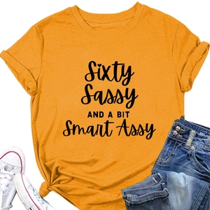 Detail of mustard yellow cotton T-shirt featuring a front knot and printed slogan