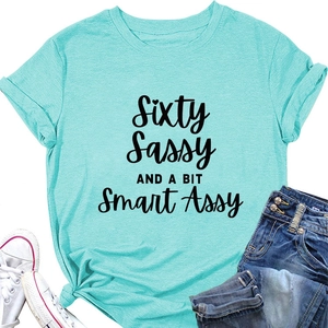 Detail of mint green Sixty Sassy T-shirt featuring rolled sleeves and artistic text print