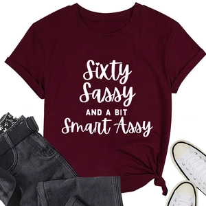 Flat lay of wine red crew neck T-shirt with Sixty Sassy and Smart Assy slogan