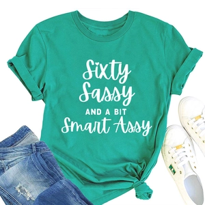 Detail of teal cotton T-shirt with white Sixty Sassy slogan and knotted hem styling