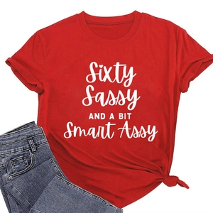 Detail of red crew neck T-shirt with Sixty Sassy white slogan and knotted hem detail