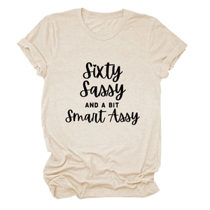 Detail of apricot crewneck T-shirt with Sixty Sassy and a bit Smart Assy print