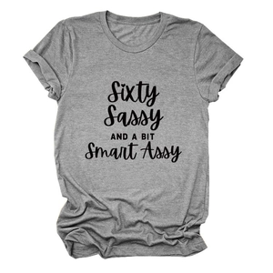 Close-up of gray cotton T-shirt featuring sassy slogan text and rolled sleeve details