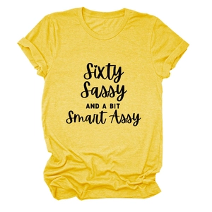 Detail of yellow round neck t-shirt with Sixty Sassy and a bit Smart Assy print