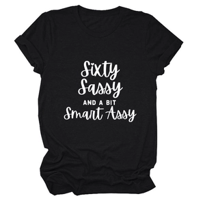 Detail of white Sixty Sassy slogan print on black cotton crewneck t-shirt fabric