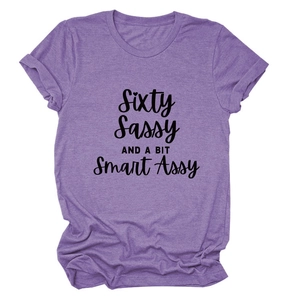 Detail of purple short sleeve tee featuring Sixty Sassy letter print and rolled cuffs