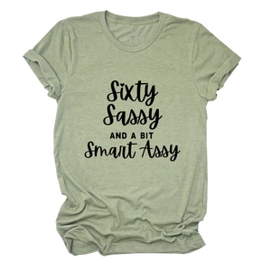 Detail of sage green cotton t-shirt featuring Sixty Sassy and Smart Assy print
