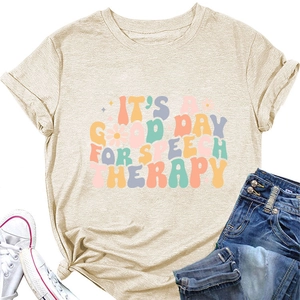 Detail of beige speech therapy t-shirt with colorful typography and floral graphics