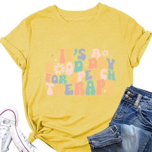 Detail of yellow cotton T-shirt with 'IT'S A GOOD DAY FOR SPEECH THERAPY' graphic print