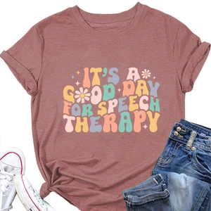 Flat lay of pink speech therapy t-shirt with floral typography and denim jeans