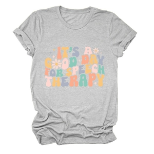 Close-up of speech therapy slogan and daisy print on grey short sleeve cotton t-shirt