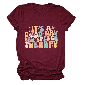 Close-up of retro floral text print on a burgundy crew neck cotton speech therapy t-shirt