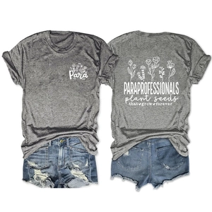 Flat lay of gray graphic T-shirt and distressed denim shorts showing front and back print