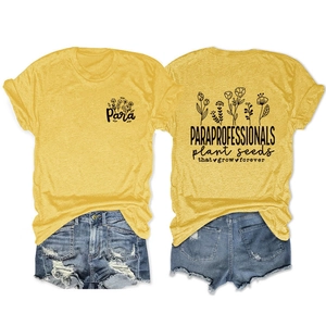 Flat lay view of yellow paraprofessional t-shirt with floral print and denim shorts