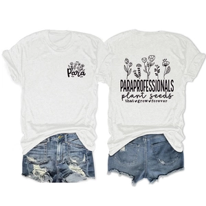 Detail view of the back graphic on the white t-shirt and distressed denim shorts outfit