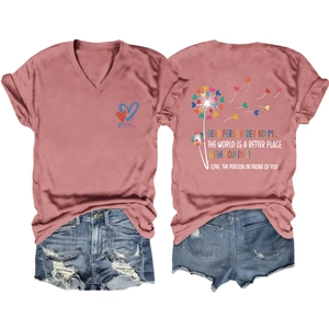Detailed flat lay of pink V-neck T-shirt with heart print and distressed denim shorts set
