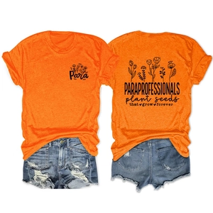 Detail of orange t-shirt with floral print and Paraprofessionals plant seeds text slogan