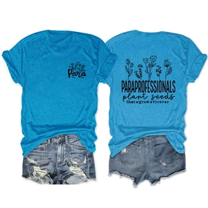 Detailed view of bright blue T-shirt with Para plant seeds print and denim shorts