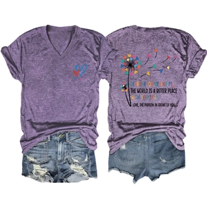 Detail of purple V-neck t-shirt with heart print and distressed denim shorts with fringe