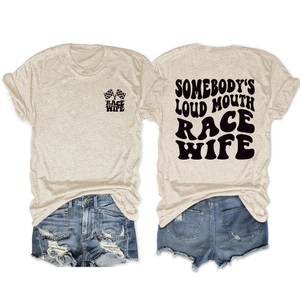 Flat lay of heather grey t-shirt with race wife print and denim shorts on white background