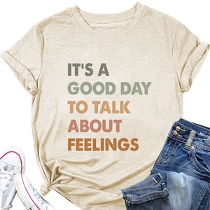 Close-up of beige t-shirt with It's a Good Day to Talk About Feelings text print